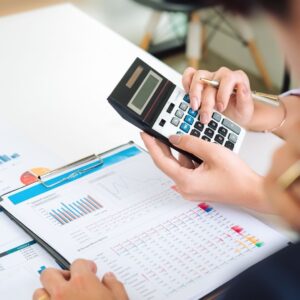 paperwork with a calculator